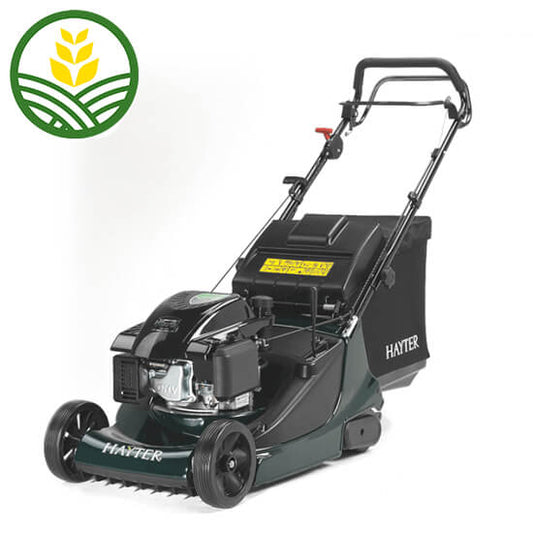 Dark green Hayter push mower with black grass box, 2 front wheels and rear roller. The engine is on top of the deck. 