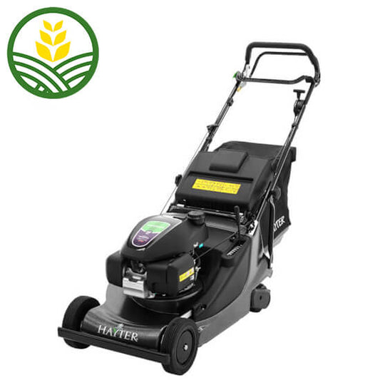 Hayter push along mower in dark green colour with black trims. Black grass box, 2 front wheels and a rear roller. The engine is on the top of the deck.