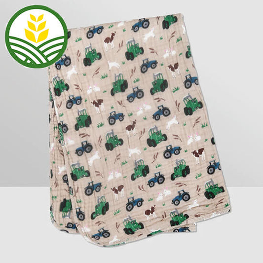 Tractor Ted Cotton Cuddle Blanket with Tractor Ted pattern printed throughout.