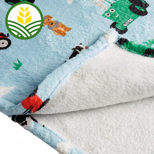 Tractor Ted Blue Snuggle Blanket with Tractor ted pattern throughout.