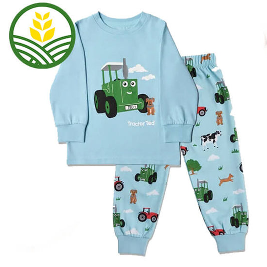 Light Blue Tractor Ted pyjamas with tractor ted and dog on top and farmyard pictures on the bottoms.